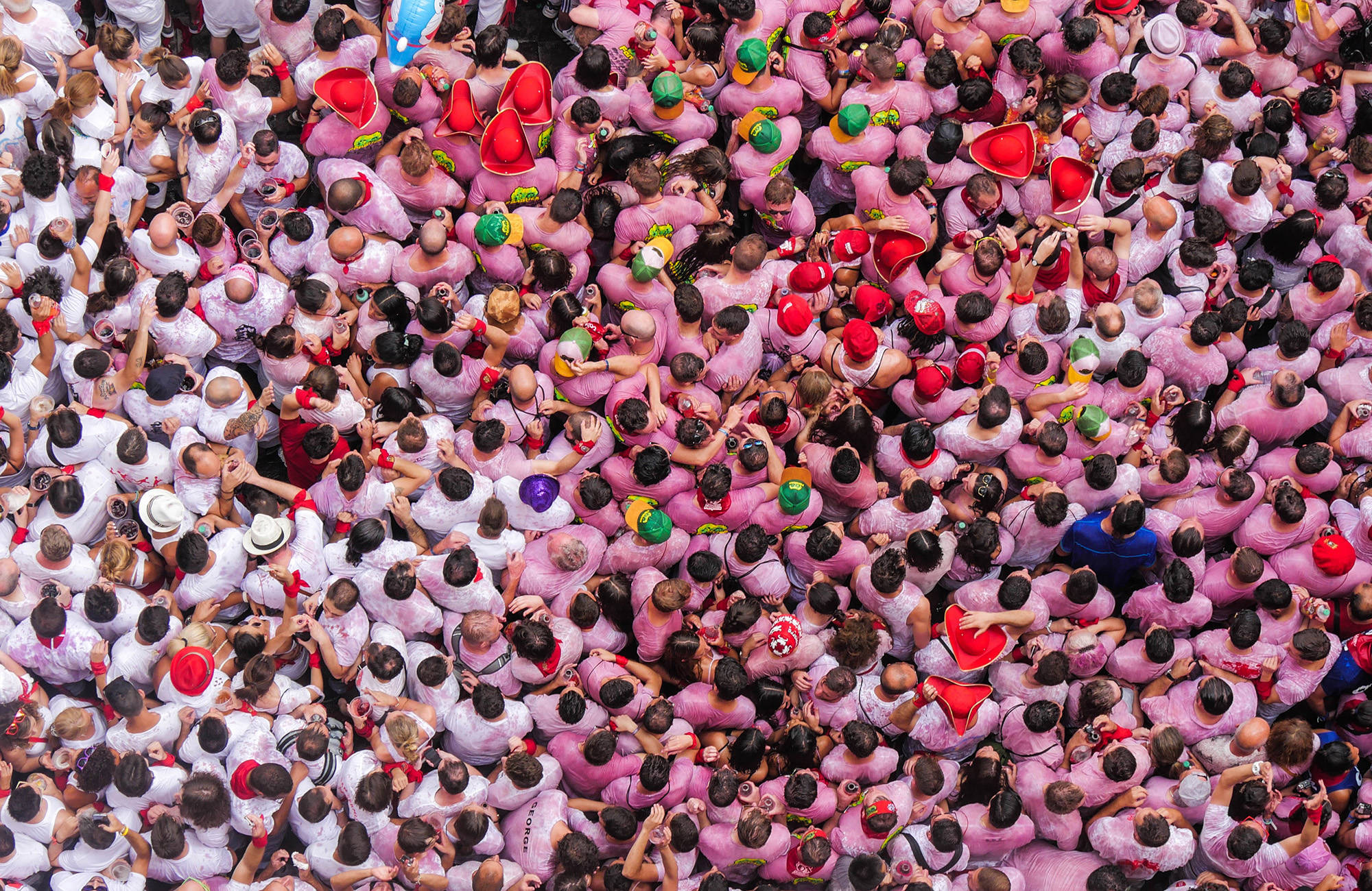 spain-pamplona-people-above-pink-cover