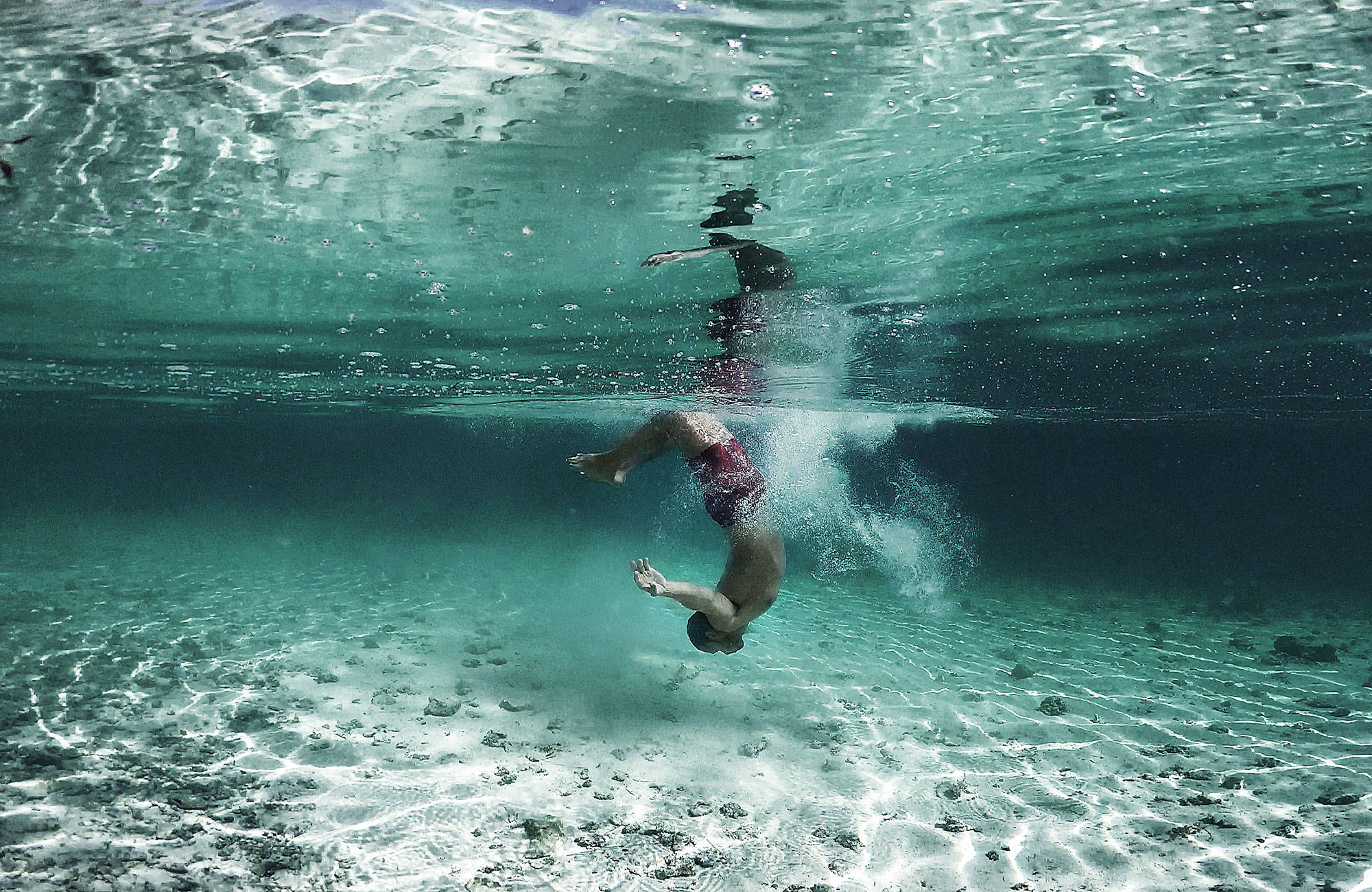 french-polynesia-man-swimming-in-ocean