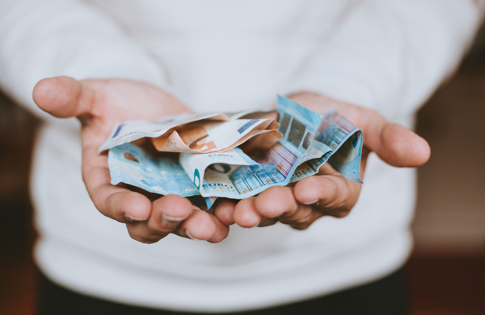 Education-money-in-hand-cover