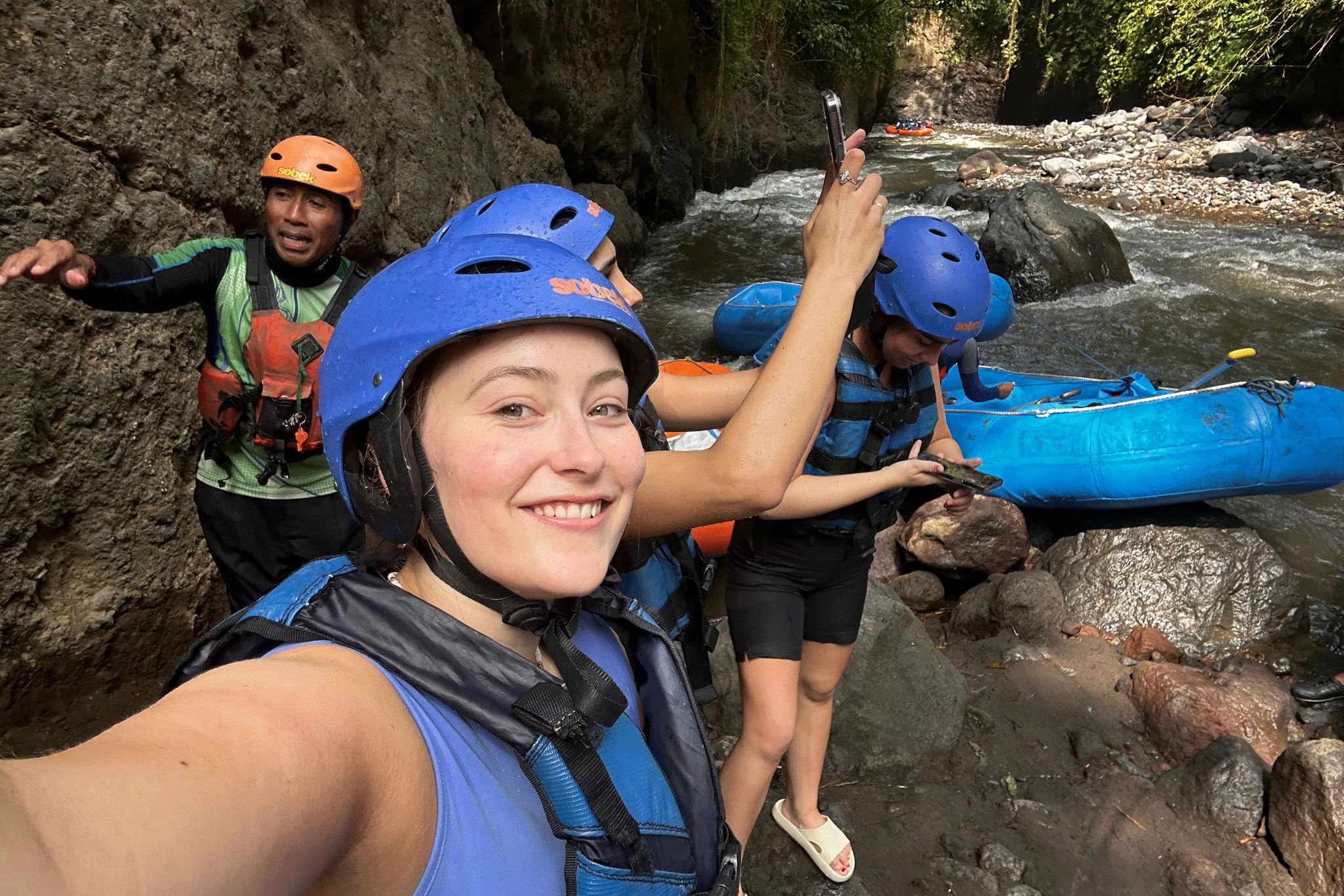 Pernille smiling in rafting gear with together with her Tripmates group on Bali