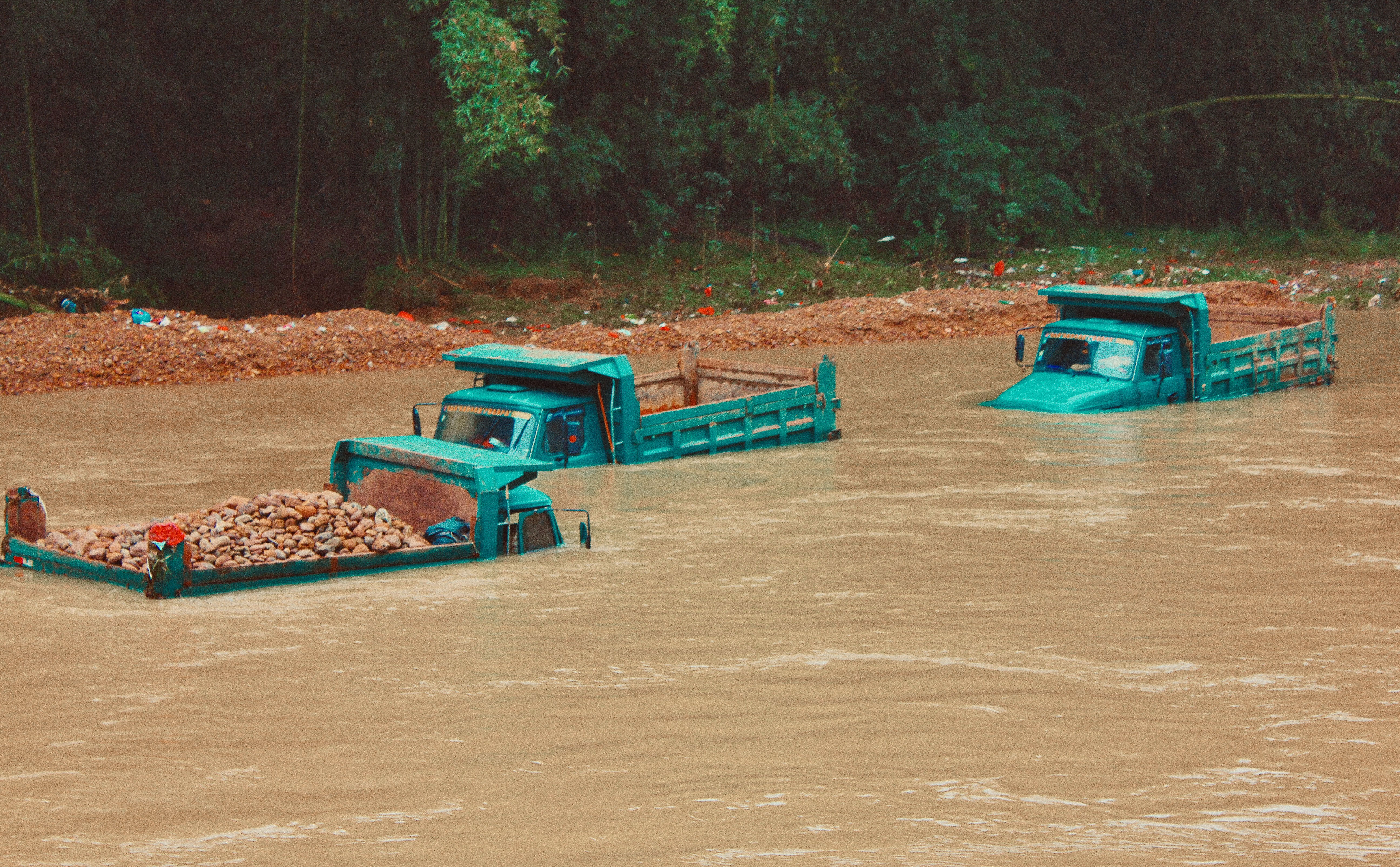 Trucks Driving On A Heavily Flooded Road In China
