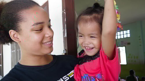 participant-holding-a-kid-3_1280x720